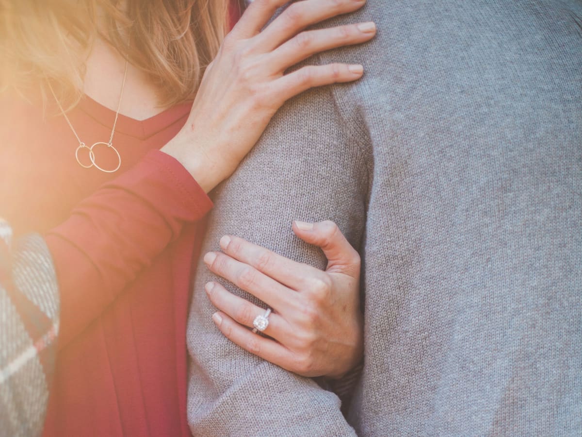 A couple in a close, warm embrace